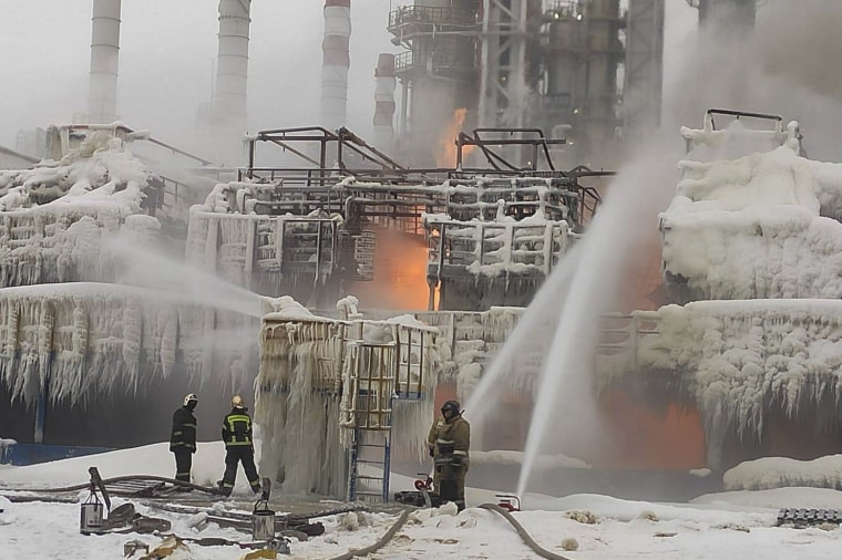 Firefighters extinguish a blaze at a chemical transport terminal at Russia's Ust-Luga port on Jan. 21, 2024. Local media reported that Ukrainian drones attacked the port.